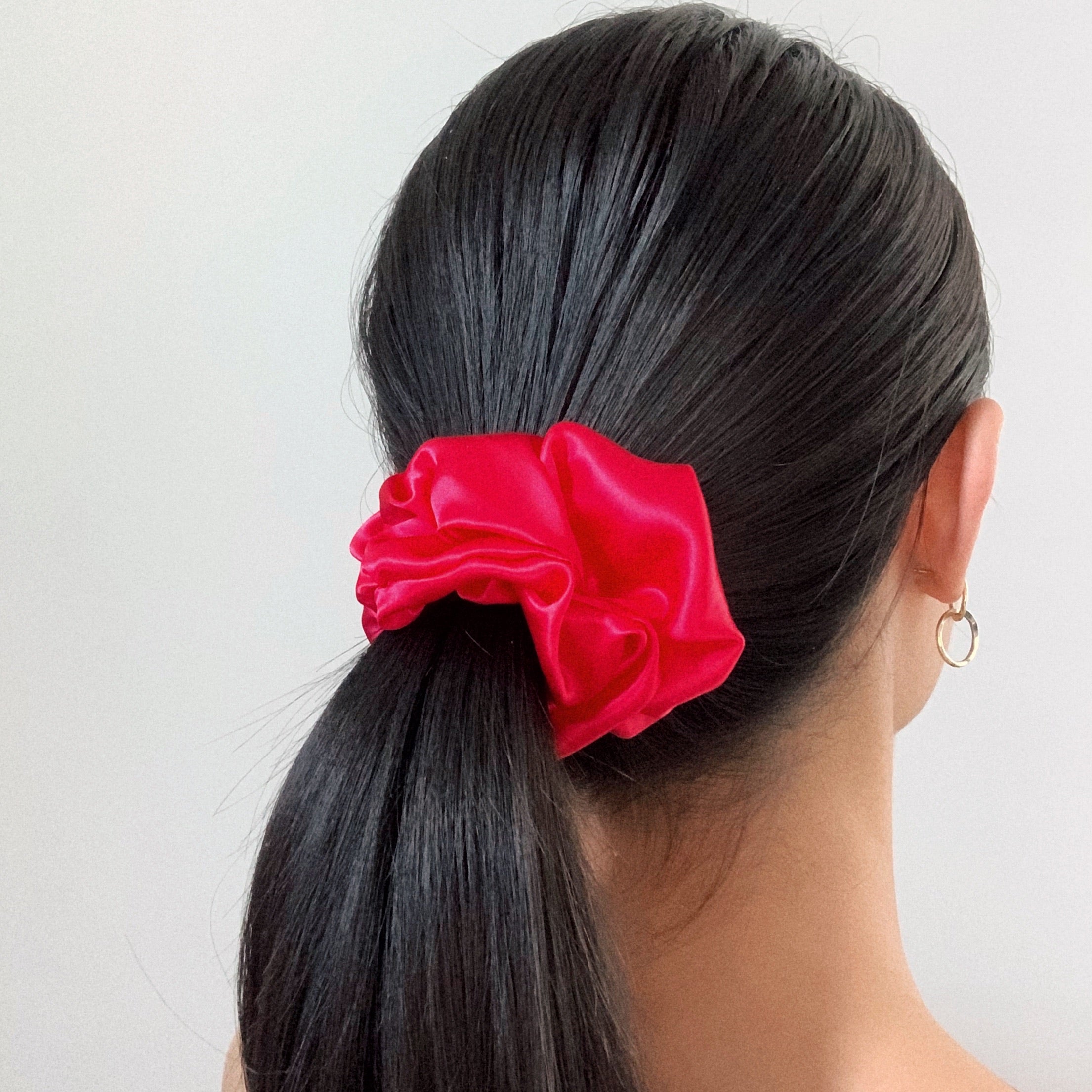 Flamingo - model wear fusia silk satin scrunchie. 
