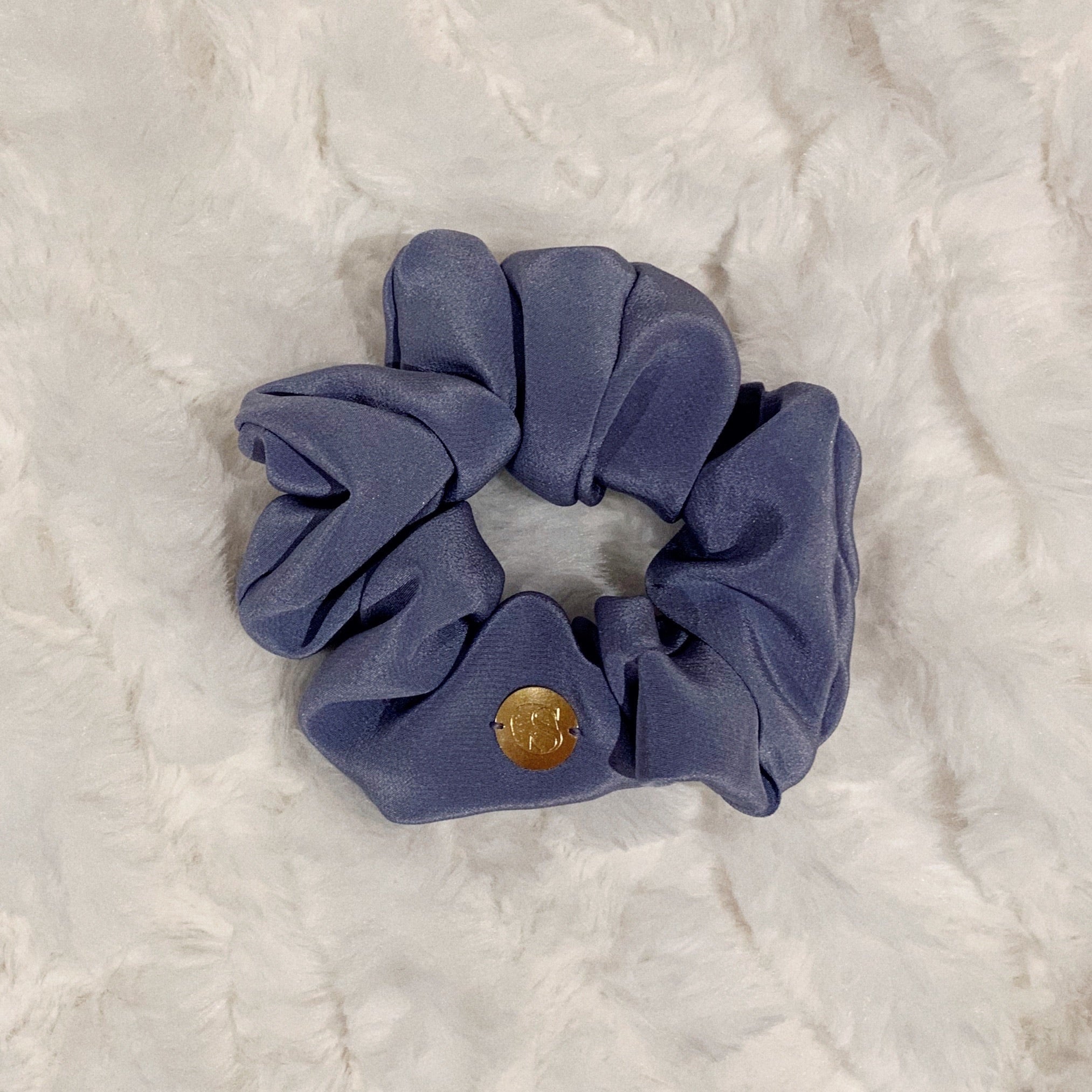 Lilac - flatlay of a light purple scrunchie.